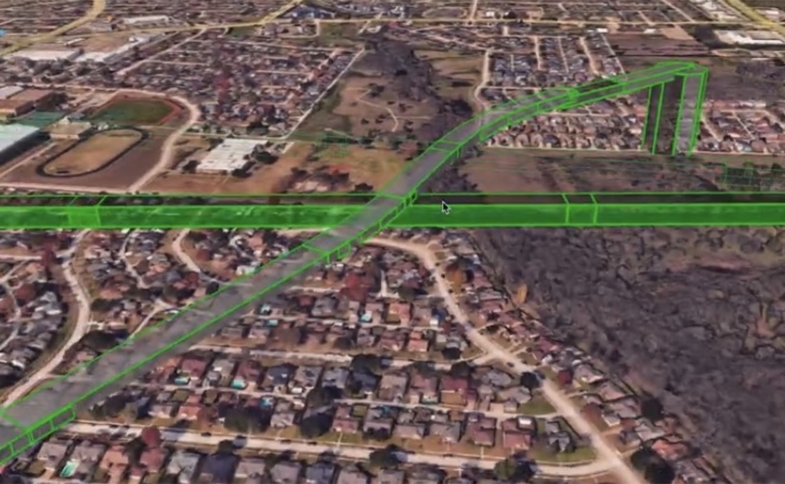Aerial view of a suburban area with green 4D flight volumes drawn along roads and corridors